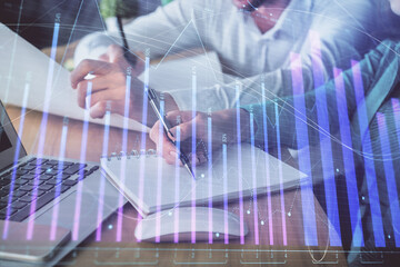 Wall Mural - Double exposure of forex chart drawing over people taking notes background. Concept of financial analysis