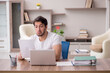 © Elnur - Young male employee working from home during pandemic