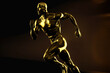 © Fatih Nizam - athletics man with golden silhouette, ai