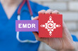 © wladimir1804 - Young female doctor holding colorful blocks with banner: EMDR. Medical concept of EMDR Eye Movement Desensitization Reprocessing. EMDR therapy.