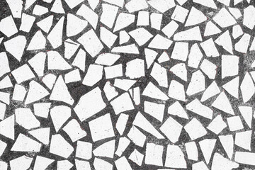 Wall Mural - Broken white tile pieces in black concrete pavement texture