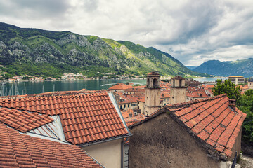 Wall Mural - Rooftop view of Kotor historical center and beautiful bay surrounded by rocky mountains in Montnegro