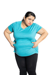 Wall Mural - Depressed overweight indian woman holding big belly waistline suffering from excess fat. Worried Asian female heavy body size problem.weight loss concept. Copy space.