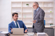 © Elnur - Two male colleagues working in the office