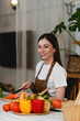 © itchaznong - Young Healthy woman cooking healthy food in the kitchen at home. Healthy lifestyle, food, diet concept.