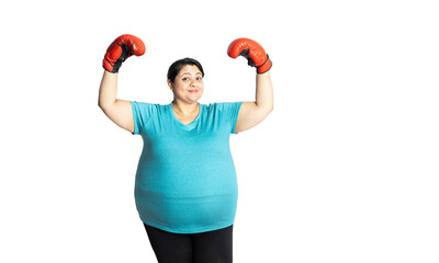 Wall Mural - Overweight indian woman wearing red boxing gloves raise hands showing her arm muscle isolated over white background, Plus size female weight loss activity concept.