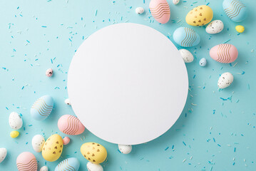Wall Mural - Easter decor concept. Top view photo of ordered composition white circle yellow blue pink easter eggs and sprinkles on isolated pastel blue background with empty space
