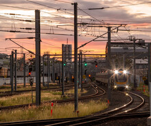 Trains Running Through Roma Street Station In The Dusk In Brisbane