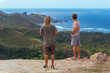 © Cavan Images - Two men standing on cliff and looking at view of seashore, Lombok, Indonesia