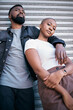 © T Mdlungu/peopleimages.com - Portrait, urban fashion and black couple in city to relax with love, care and date together. Cool street style of young man, woman and people in relationship outdoor for freedom of edgy lifestyle