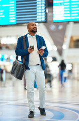 Wall Mural - Black man checking flight schedule with phone and ticket walking in airport terminal, holding passport for business trip. Smile, travel app and happy businessman boarding international destination.