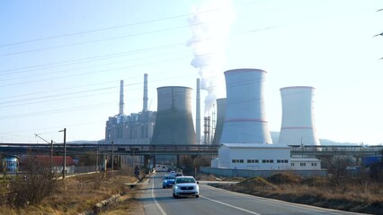 Wall Mural - The chimney of a thermal power plant, the smoke extracted by a thermal power plant on the chimney, in the production process. Environment. Pollution.