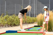 © Angelov - mother and daughter playing mini golf, children enjoying summer vacation