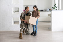 Happy Military Serviceman Holding Cardboard Box With Girl