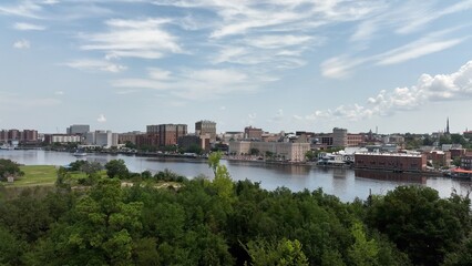 Wilmington, NC big city skyline beside water with office buildings with workers in inner city architecture
