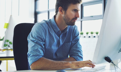 Computer, serious or hacker man for cybersecurity, app coding or data analysis in office. Programmer, developer or employee typing on tech for software code, programming or startup analytics review
