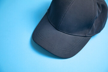 Wall Mural - Baseball cap on the blue background.