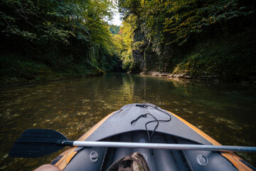 Rafting on a boat, kayak, SUP board Beautiful canyon mountain river, christal blue water, green tree. Travel and active life style. Vacation. Martvili in Georgia near Kutaisi