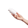 Female hand holding blank white squeeze bottle plastic tube on transparent background. Packaging for pills, capsules or supplements. Mockup