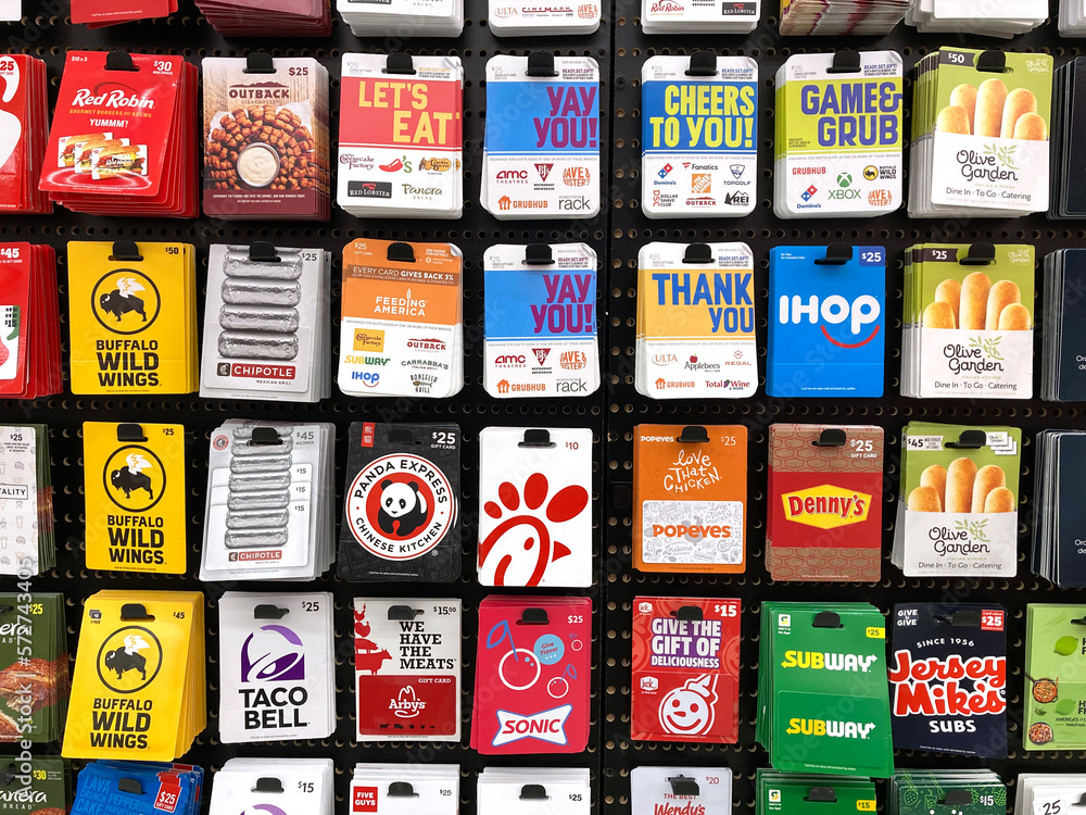 Multiple types of fast food and restaurant plastic gift cards displayed