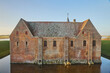 © Виктор Осипенко - Majestic castle surrounded by a moat in Denmark at sunset, back view