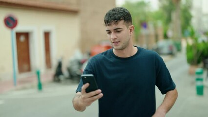 Sticker - Young hispanic man smiling confident making selfie by the smartphone at street