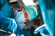 Surgical resident performing maxillofacial surgery