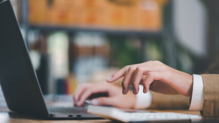Aufkleber - accountant calculating figures in company financial online documents with a calculator,analysis of company financial data,Planning to assess and review budgets,concept of finance and investment