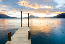 View Of A Setting Sun From A Dock In Panajachel, In The Edges Of Lake Atitla, Guatemala.