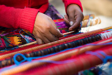 Detail Of The Hands Of A Mayan Woman Weaving A Huipil.