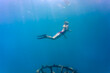© Cavan Images - Woman snorkeling in Indian Ocean, Permuteran, Bali, Indonesia