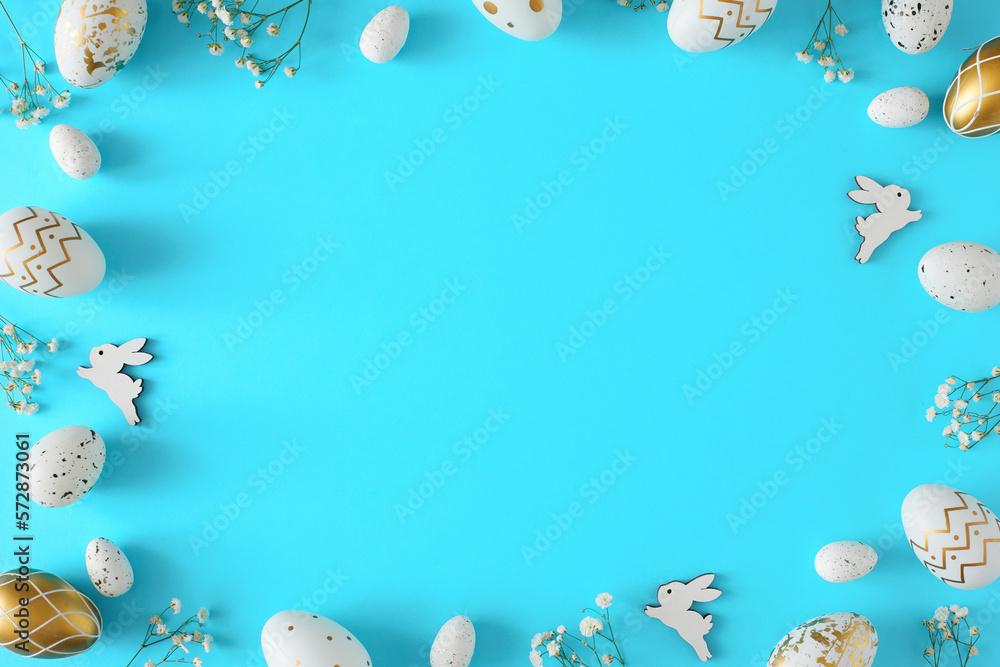 Easter concept. Flat lay photo of white and gold eggs with cute rabbits ...
