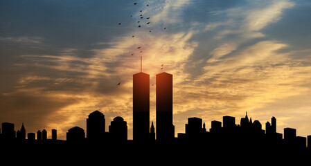 new york skyline silhouette with twin towers and birds flying up like souls at sunset. 09.11.2001 am