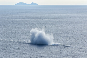 the huge explosion in the sea of terracina following the crash of a eurofighter typhoon that crashed. Near the water blast are lifeboats to the rescue