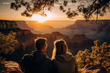 Couple Watching The Sunset At The Grand Canyon Valley In The USA, Travel Photography For Tourism Or Poster Advertisement