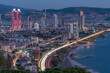 View of izmir city with high buildings and roads with car lights and evening light of city