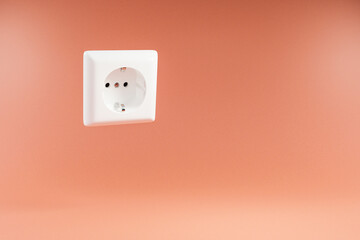 single white power socket floating in the air over infinite orange colored background; 3D Illustration