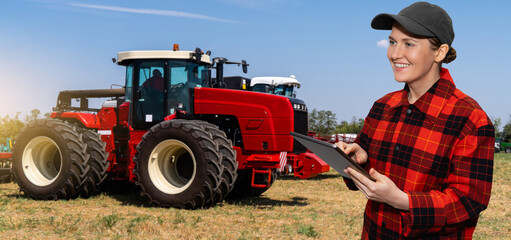 Autocollant - Woman farmer with a digital tablet on the background of an agricultural tractor	