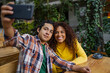 © Creative Sparks - Young couple outdoors taking a selfie