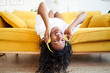 © CarlosBarquero - Looking at the camera of beautiful motivated young woman excited at home enjoys listening music with headphones. High quality photo