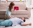 © Elnur - Young couple in first aid concept at home