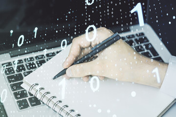 Poster - Double exposure of creative abstract binary code hologram and hand writing in notebook on background with laptop. Database and programming concept