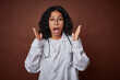 © Asier - Young colombian doctor woman with stethoscope surprised and shocked.