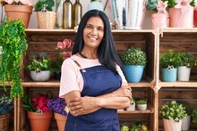 Middle Age Hispanic Woman Florist Smiling Confident Standing With Arms Crossed Gesture At Florist