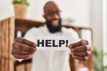 Poster - African american man holding help reminder smiling and laughing hard out loud because funny crazy joke.