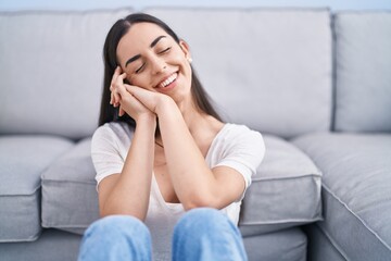 Poster - Young hispanic woman smiling confident sitting on floor at home