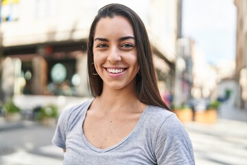 Sticker - Young beautiful hispanic woman smiling confident standing at street