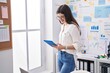 © Krakenimages.com - Young caucasian woman business worker smiling confident using touchpad at office