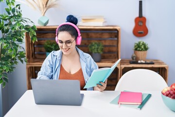 Sticker - Young caucasian woman sitting on table studying at home