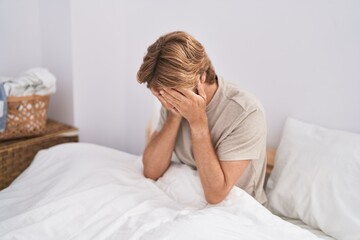 Poster - Young man stressed sitting on bed crying at bedroom